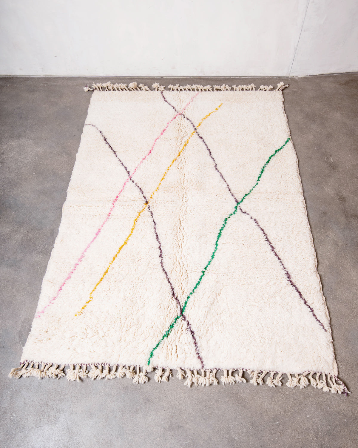 Modern, designer, handcrafted Berber rug from Morocco. Beniourain carpet with beautiful colours and patterns and fluffy wool texture.